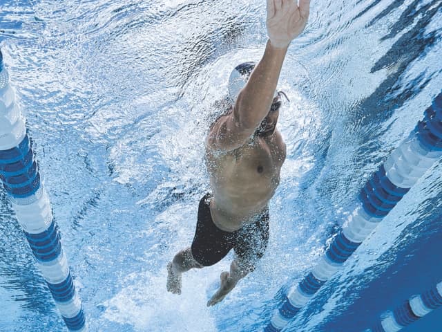 Man performing the freestyle stroke in a lap pool